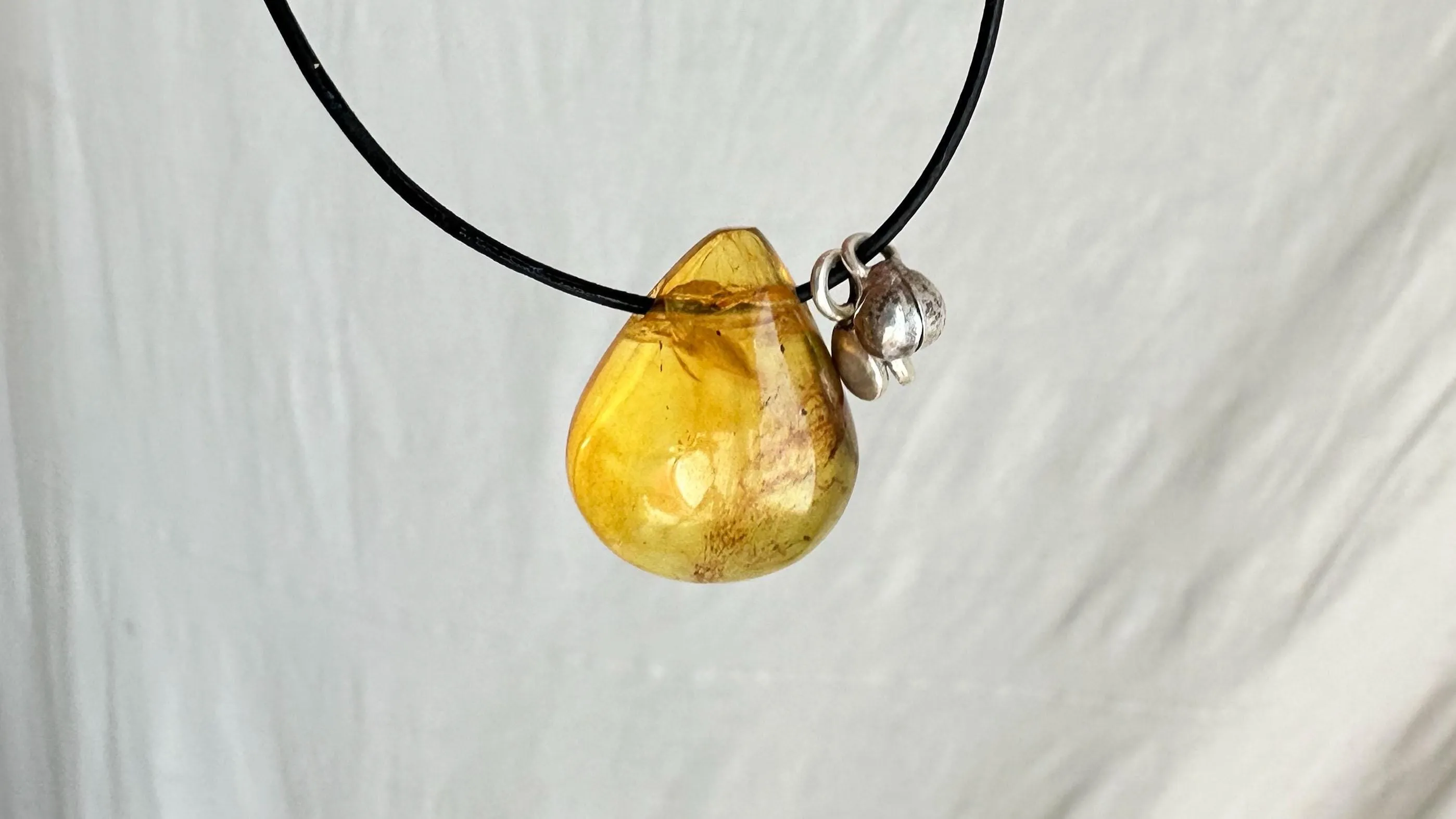 Large Amber Pendant on a Leather Cord. 0605