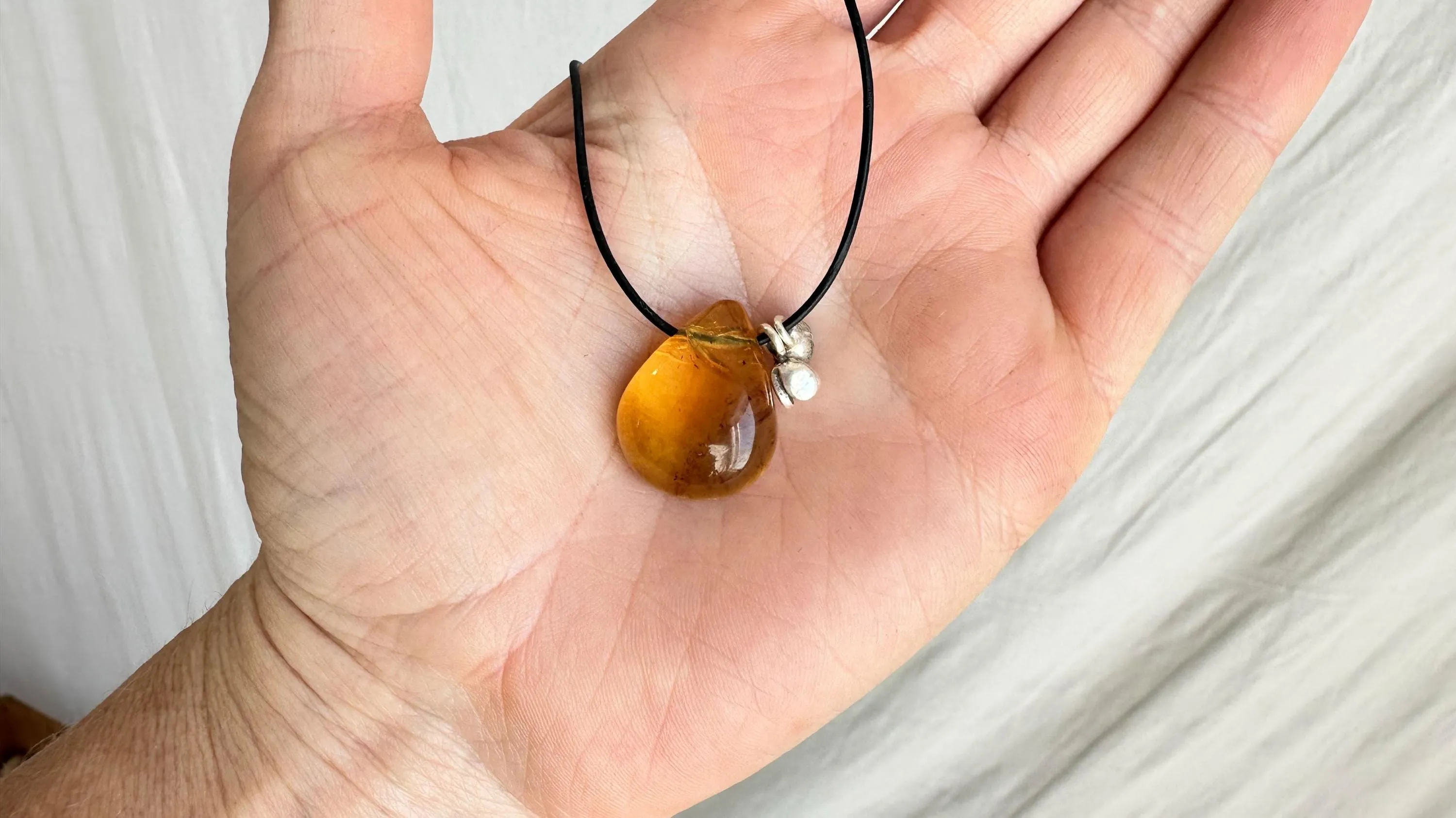Large Amber Pendant on a Leather Cord. 0605