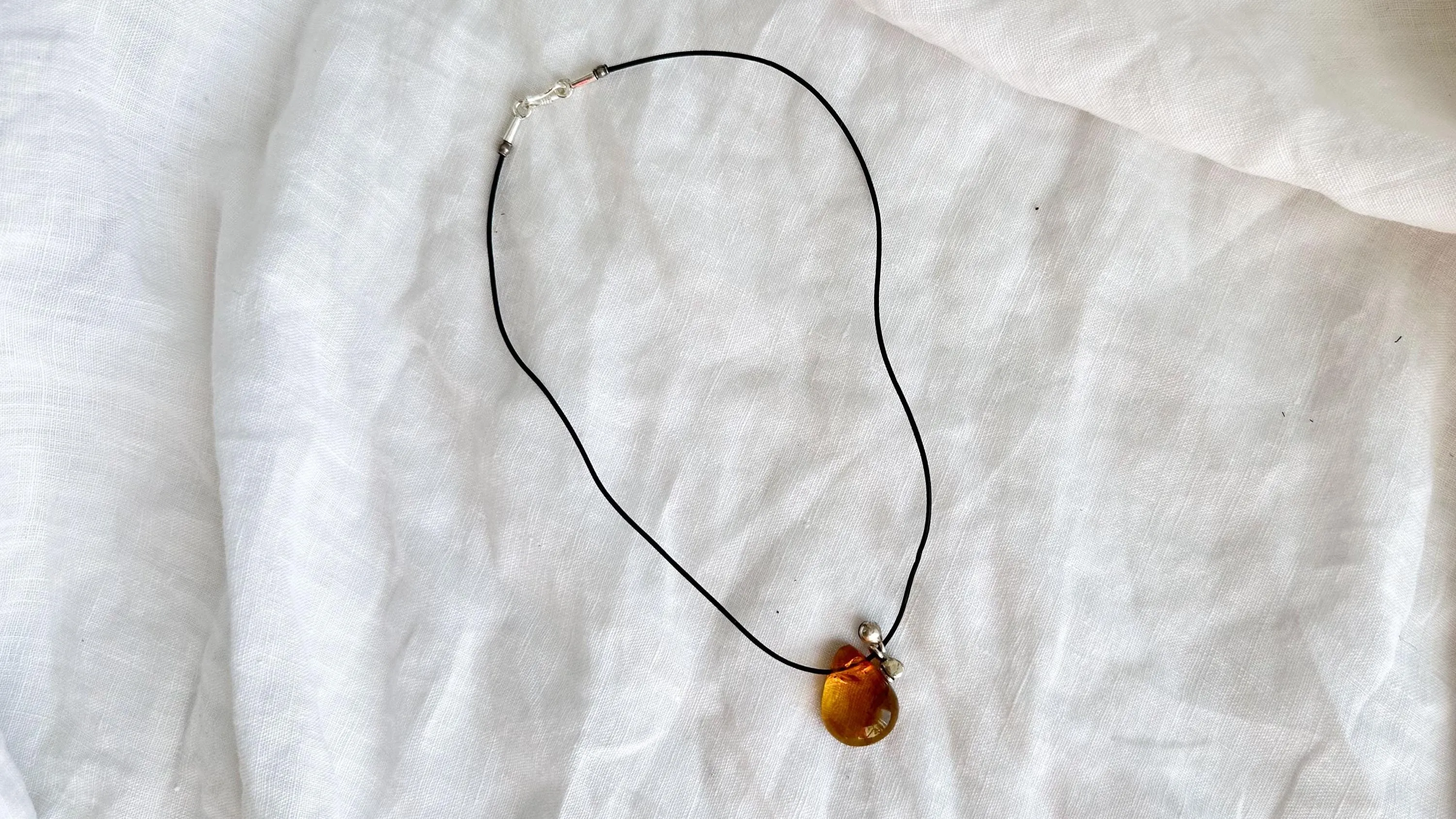 Large Amber Pendant on a Leather Cord. 0605