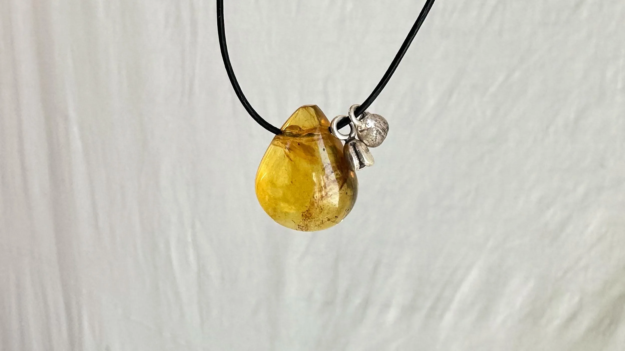 Large Amber Pendant on a Leather Cord. 0605