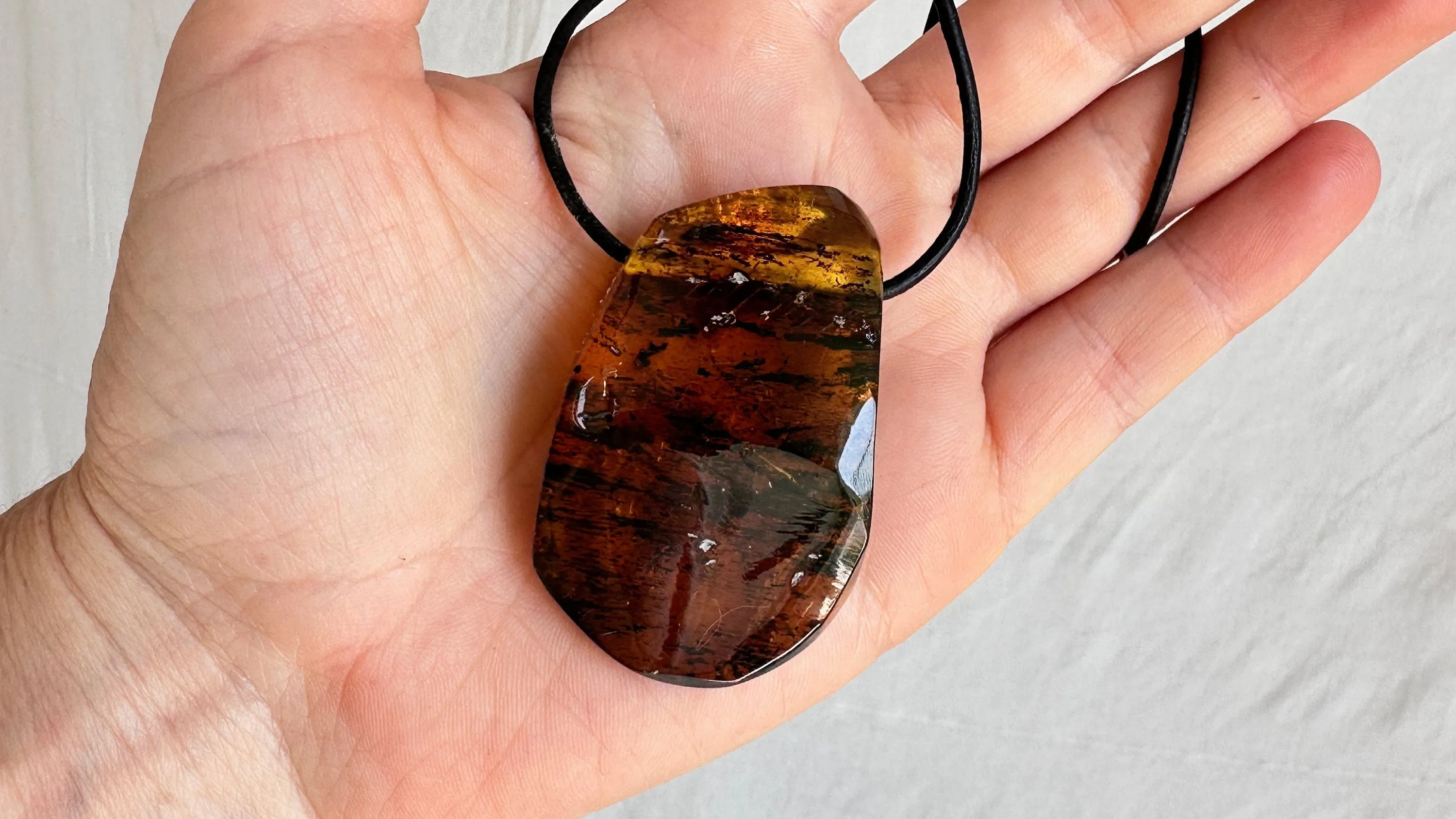 Large Amber Pendant on a Leather Cord. 1173