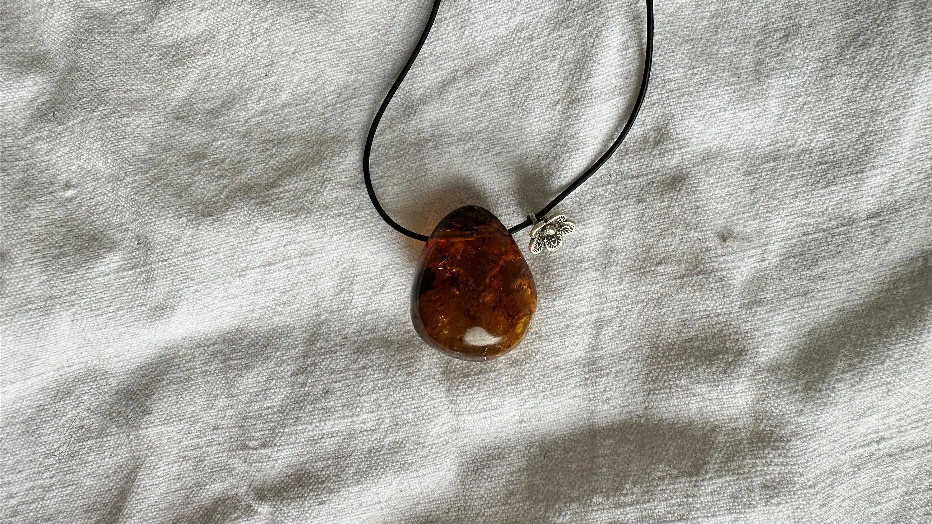 Large Amber Pendant on a Leather Cord. 1426