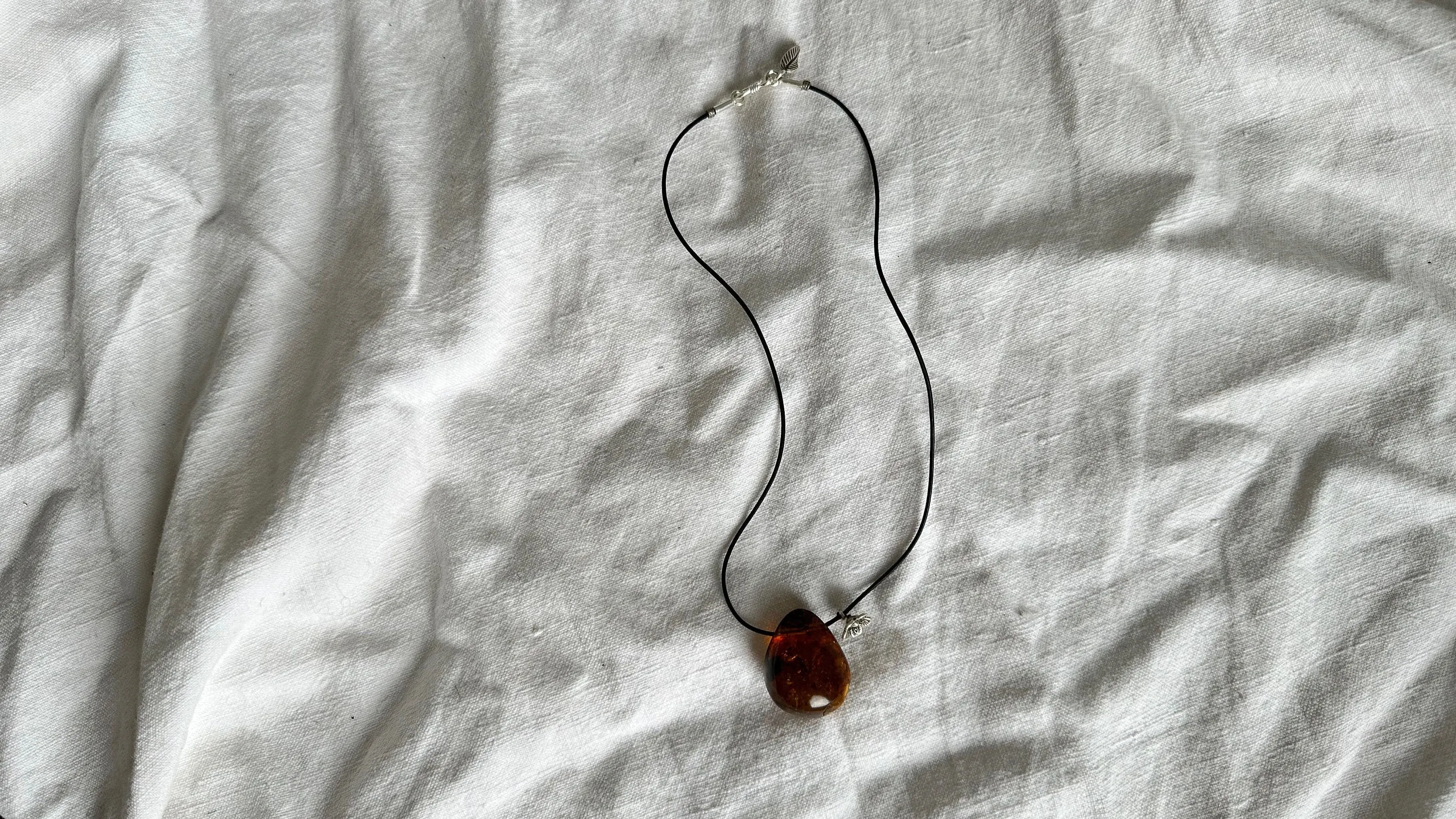Large Amber Pendant on a Leather Cord. 1426
