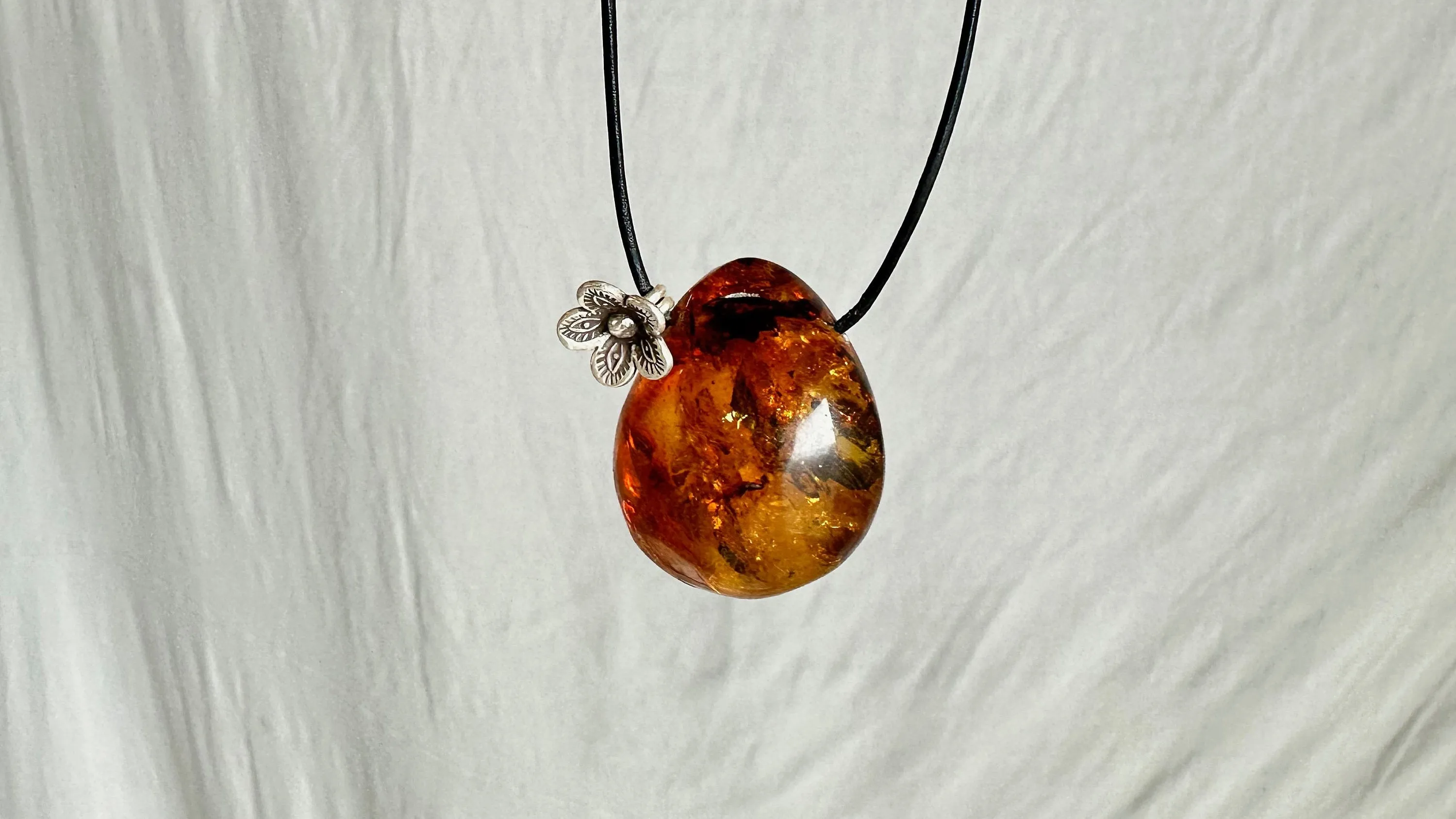 Large Amber Pendant on a Leather Cord. 1426