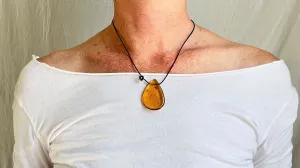 Large Amber Pendant on a Leather Cord. 1428. IN COMPLIANCE