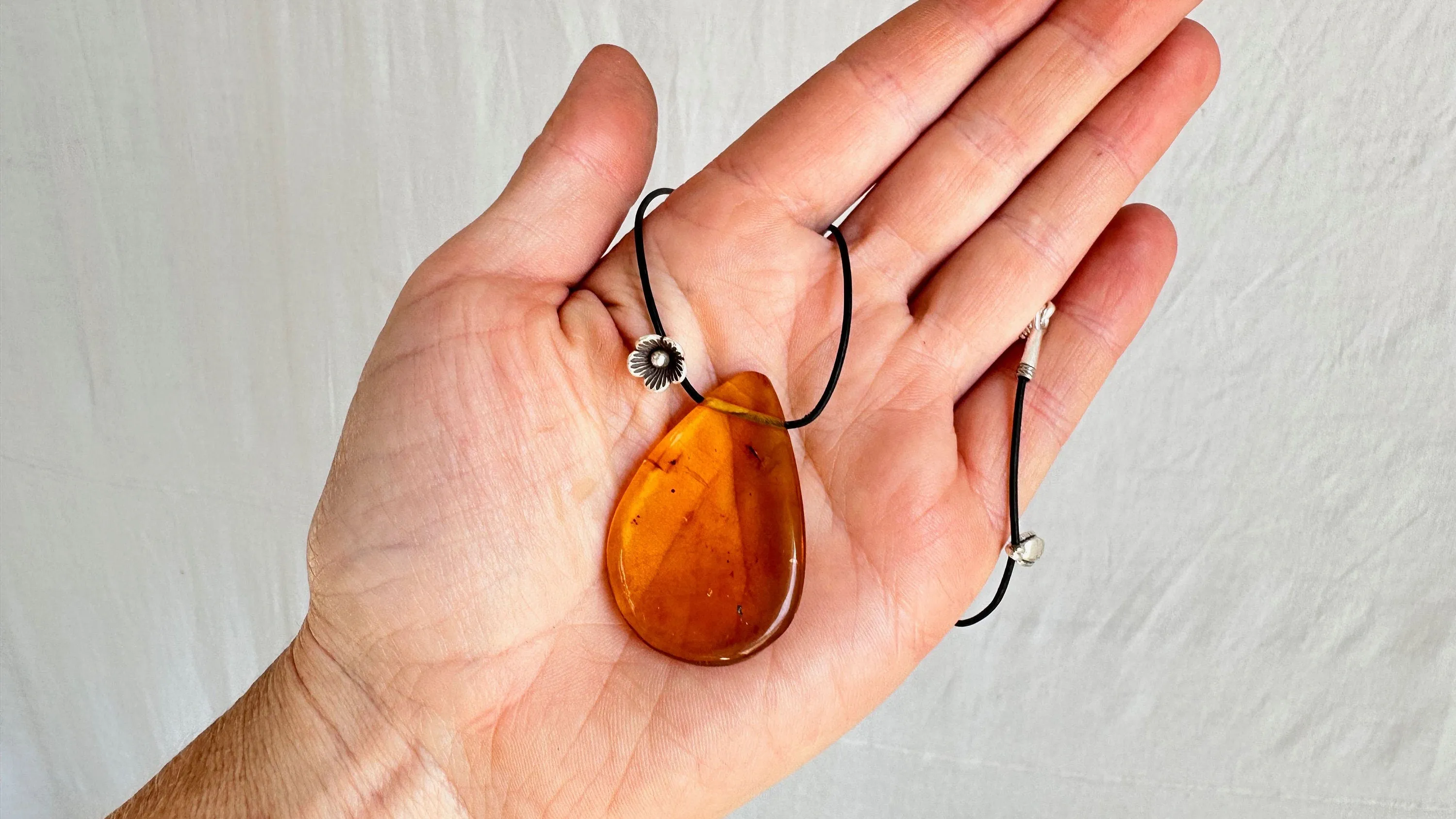 Large Amber Pendant on a Leather Cord. 1428. IN COMPLIANCE