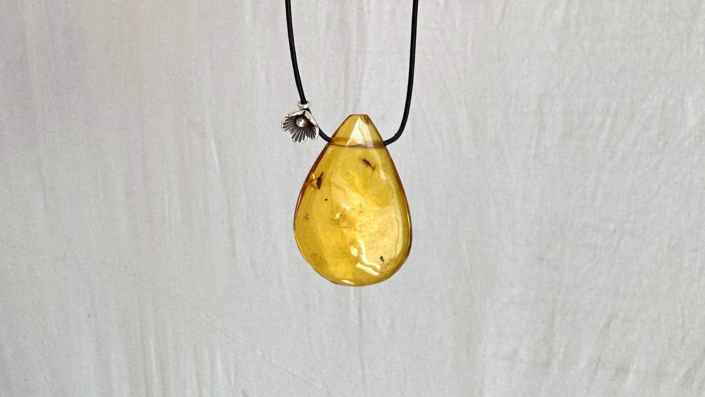Large Amber Pendant on a Leather Cord. 1428. IN COMPLIANCE