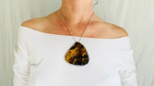 Large Amber Pendant on a Silver Cord. Snake Chain.